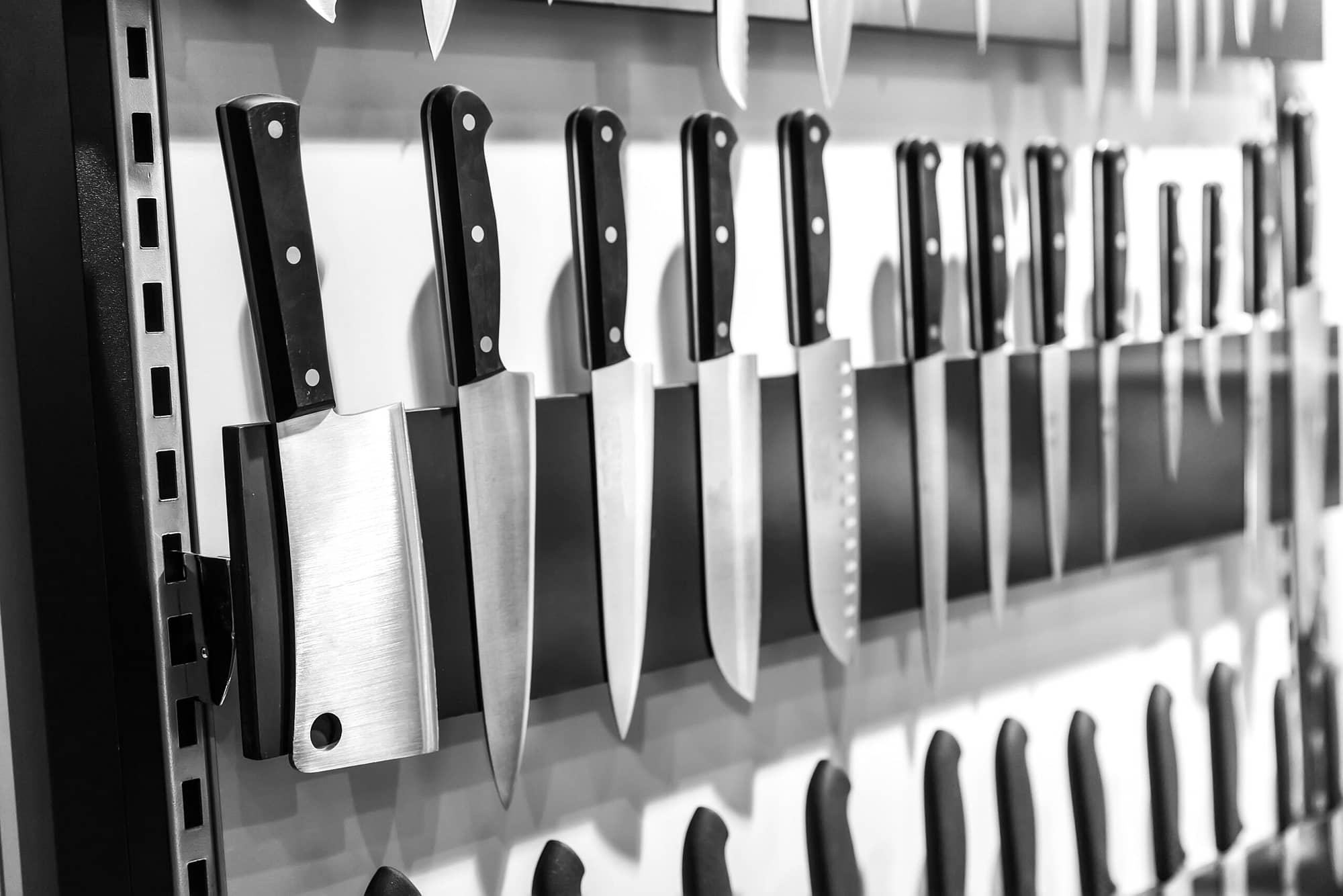 Kitchen knives on magnetic holder closeup